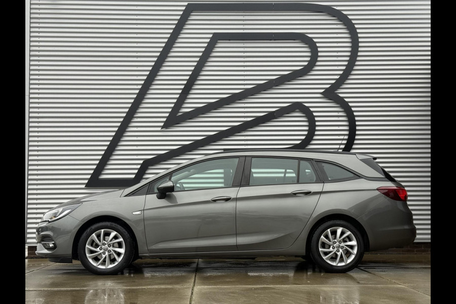 Opel Astra Sports Tourer 1.2 Business Edition 2e Eigenaar,Apple Carplay,Airco,Camera,Cruise,PDC,Trekhaak,N.A.P,APK tot 07-2026