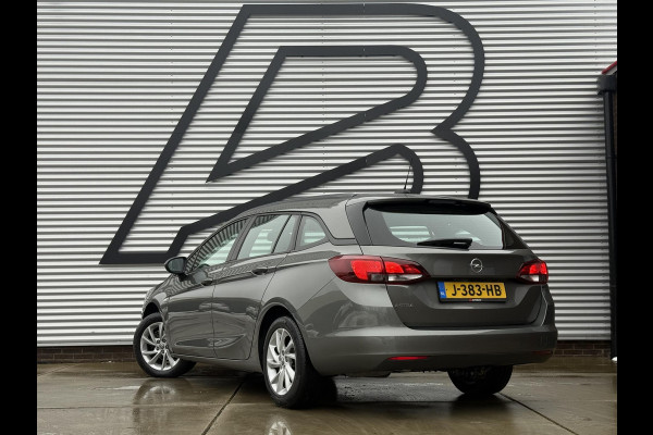 Opel Astra Sports Tourer 1.2 Business Edition 2e Eigenaar,Apple Carplay,Airco,Camera,Cruise,PDC,Trekhaak,N.A.P,APK tot 07-2026