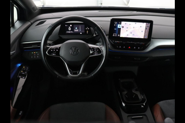 Volkswagen ID.4 First 77 kWh | Trekhaak | Stoel & stuurverwarming | Adaptive cruise | Camera | Carplay | Half leder | Navigatie | 20'' | Full LED | Keyless | Climate control | Sfeerverlichting