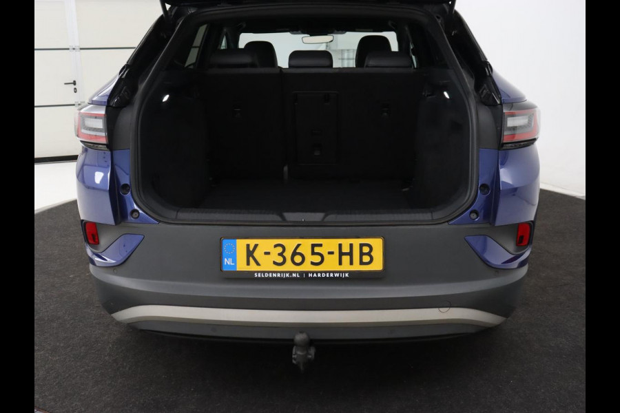 Volkswagen ID.4 First 77 kWh | Trekhaak | Stoel & stuurverwarming | Adaptive cruise | Camera | Carplay | Half leder | Navigatie | 20'' | Full LED | Keyless | Climate control | Sfeerverlichting
