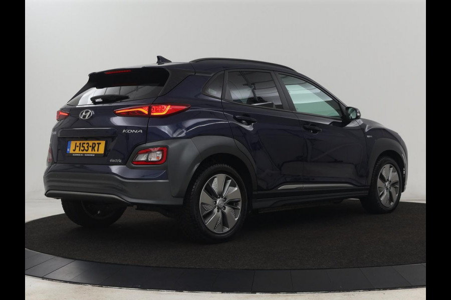 Hyundai Kona EV Premium 64 kWh | 3-Fase | SOH 100% | Leder | Stoelventilatie | Adaptive cruise | Camera | Carplay | Achterbankverwarming | Navigatie | Keyless