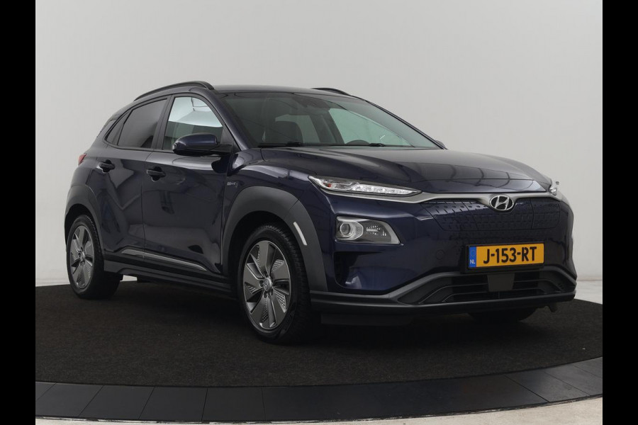 Hyundai Kona EV Premium 64 kWh | 3-Fase | SOH 100% | Leder | Stoelventilatie | Adaptive cruise | Camera | Carplay | Achterbankverwarming | Navigatie | Keyless