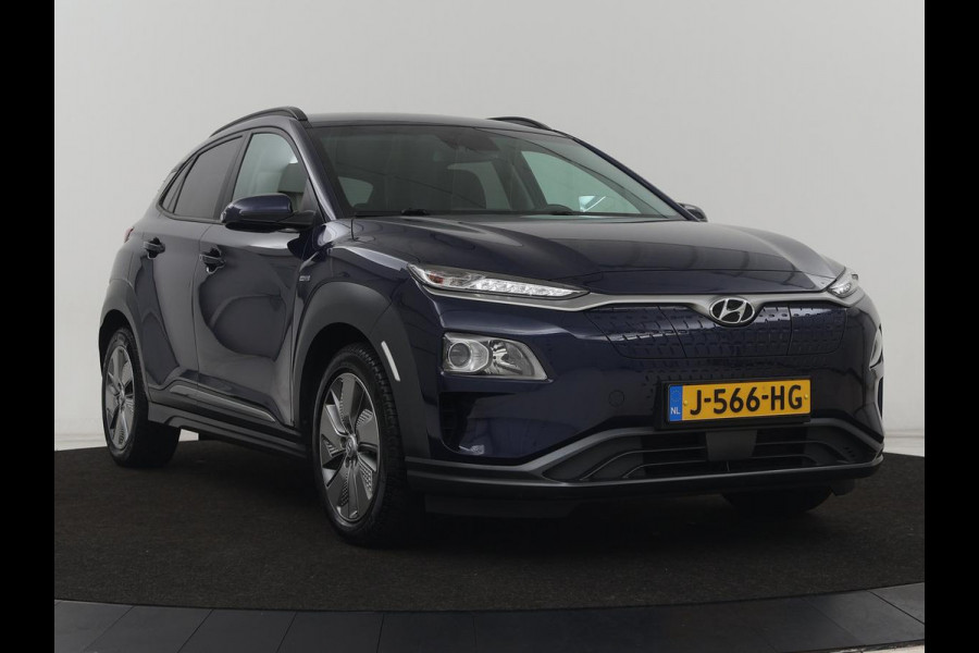 Hyundai Kona EV Fashion 64 kWh | 3-Fase | SOH 100% | Head-Up | Adaptive cruise | Carplay | Warmtepomp | Camera | Krell Audio | Navigatie | Parkeerhulp