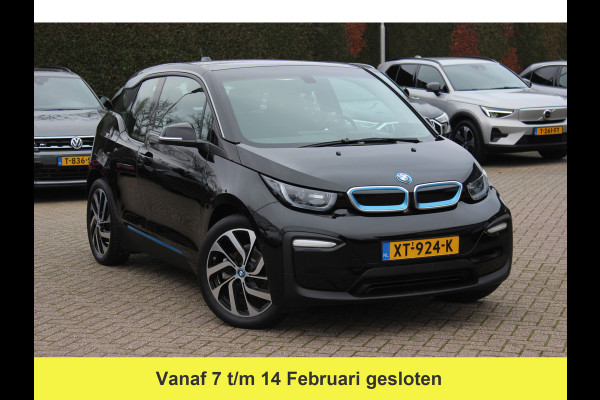 BMW i3 Basis 120Ah 42 kWh / SoH 91.4% / Navigatie / 19'' / Parkeerhulp achter / Navigatie / Harman Kardon / Stoelverwarming / Cruise Control / Warmtepomp / Getint glas