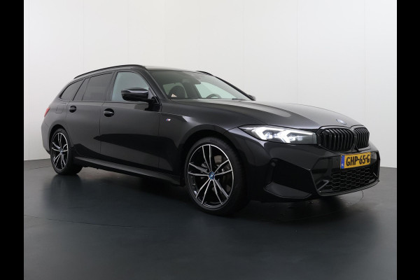 BMW 3 Serie Touring 320e VAN € 42.899,- VOOR € 39.877,- UW LENTEVOORDEEL: €3.022,-! | M-SPORT | FACELIFT| PANO|1.STE EIGENAAR, DEALER OH. | LEER | ELEK. TREKHAAK| FABRIEKSGARANTIE T/M 08 2027| LEER| STOELVERWARMING| 19 INCH! SUPER COMPLEET!