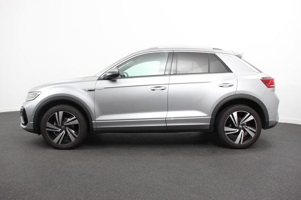Volkswagen T-Roc 1.5 TSI 150pk DSG R-Line | Navigatie | Apple Carplay/Android Auto | Parkeersensoren | Camera | Blind Spot Assist | Adaptive Cruise Control | Elektrische achterklep | Stoel- en stuurverwarming | Climate Control | Ledverlichting | Virtual Cockpit