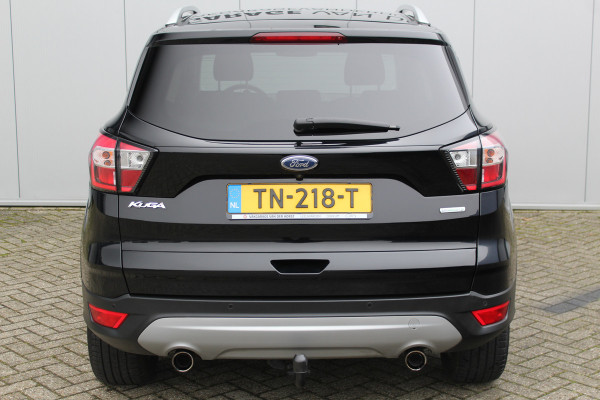 Ford Kuga 1.5-150pk EcoBoost Titanium. Nette Ford Kuga met een trekgewicht van maar liefst 2.000kg ! Autm. airco, stoel-, stuur- en voorraamverw., camera, parkeersensoren achter, navigatie, telefoonvoorb.,  17"LM wielen+all season banden, trekhaak, adapt. cruise cntrl etc.