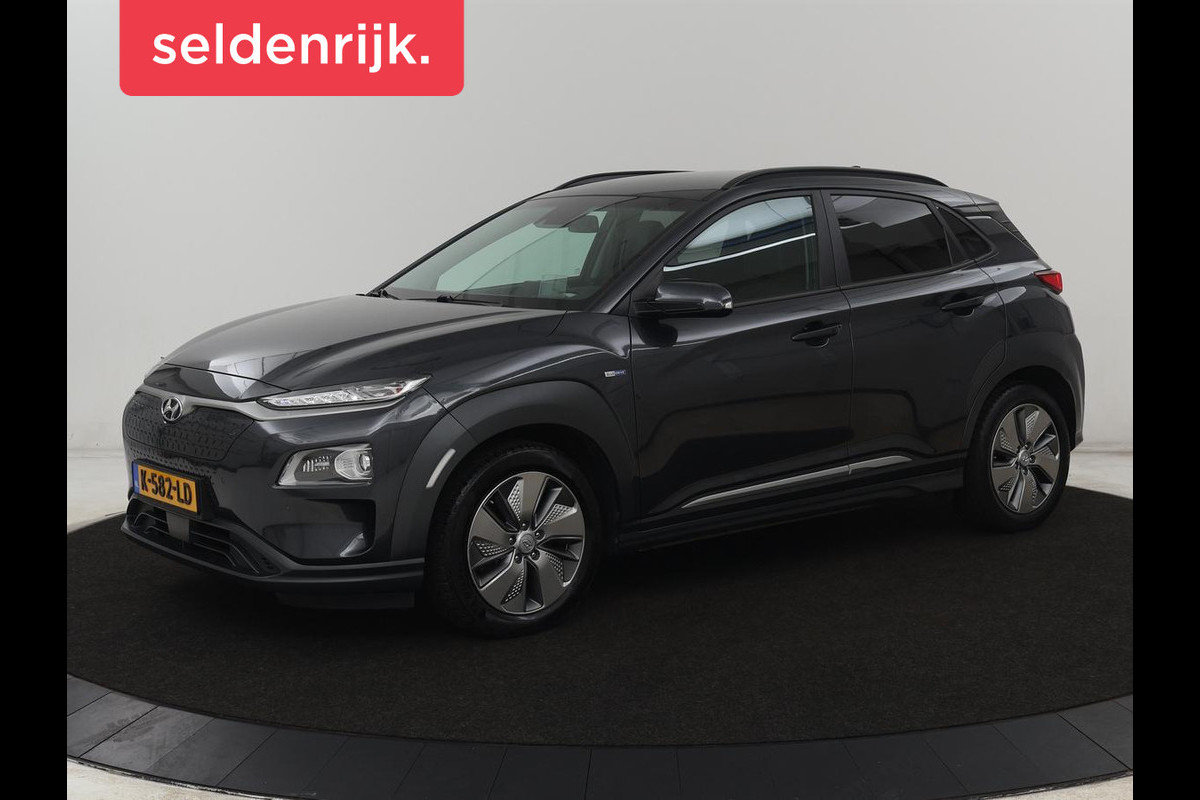 Hyundai Kona EV Limited 64 kWh | SOH 100% | 3 Fase | Stoelventilatie | Head-Up | Adaptive cruise | Camera | Leder | Carplay | Achterbankverwarming | Warmtepomp | Keyless | Full LED | Dodehoek detectie