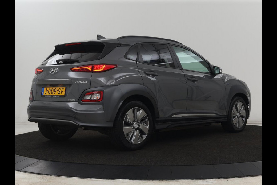 Hyundai Kona EV Premium 64 kWh | SOH 100% | 3 Fase | Stoelventilatie | Leder | Head-Up | Warmtepomp | Camera | Achterbankverwarming | Carplay | Navigatie | Adaptive cruise | Keyless | Parkeerhulp