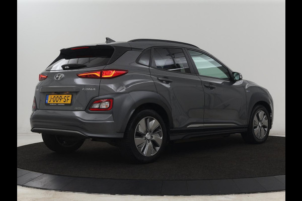 Hyundai Kona EV Premium 64 kWh | SOH 100% | 3 Fase | Stoelventilatie | Leder | Head-Up | Warmtepomp | Camera | Achterbankverwarming | Carplay | Navigatie | Adaptive cruise | Keyless | Parkeerhulp