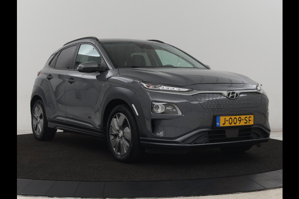 Hyundai Kona EV Premium 64 kWh | SOH 100% | 3 Fase | Stoelventilatie | Leder | Head-Up | Warmtepomp | Camera | Achterbankverwarming | Carplay | Navigatie | Adaptive cruise | Keyless | Parkeerhulp