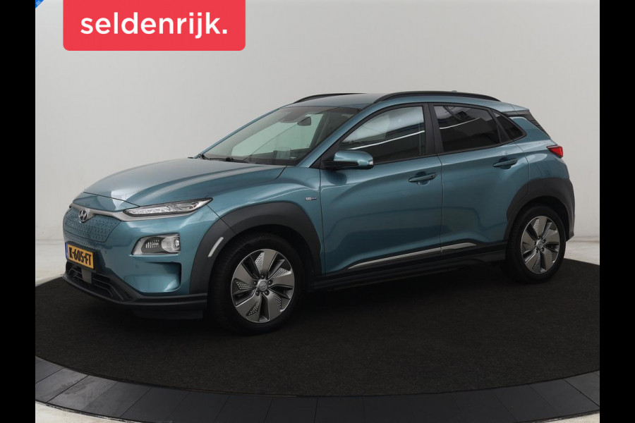 Hyundai Kona EV Premium 64 kWh | SOH 95% | Stoelventilatie | Leder | Head-Up | Warmtepomp | Camera | Achterbankverwarming | Carplay | Navigatie | Adaptive cruise | Keyless | Parkeerhulp