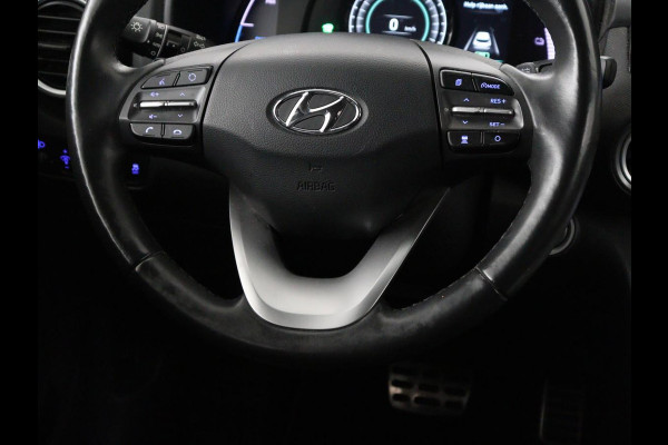 Hyundai Kona EV Premium 64 kWh | SOH 95% | Stoelventilatie | Leder | Head-Up | Warmtepomp | Camera | Achterbankverwarming | Carplay | Navigatie | Adaptive cruise | Keyless | Parkeerhulp