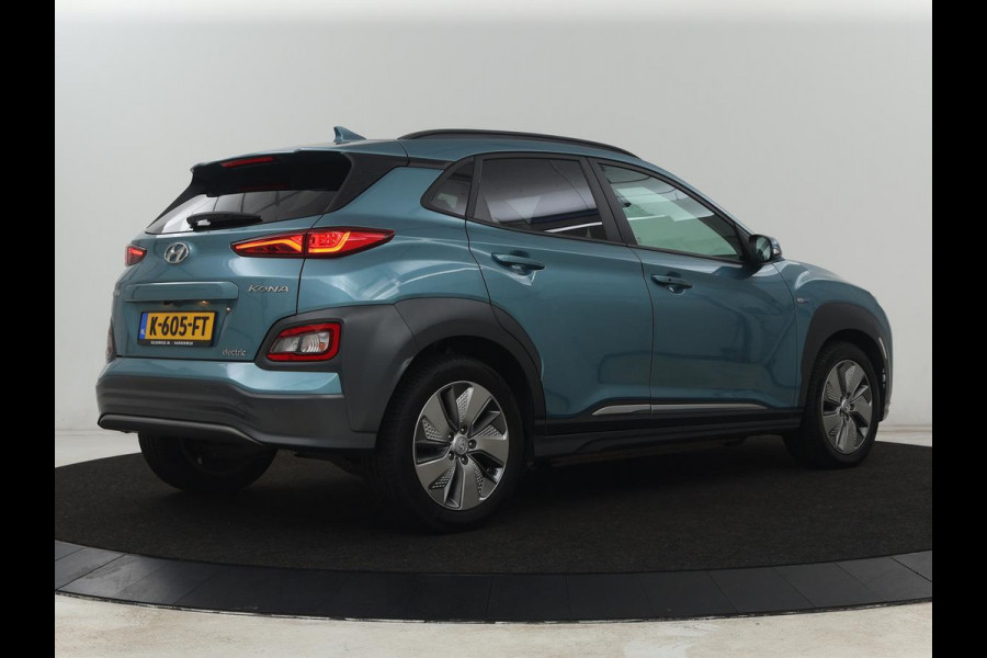 Hyundai Kona EV Premium 64 kWh | SOH 95% | Stoelventilatie | Leder | Head-Up | Warmtepomp | Camera | Achterbankverwarming | Carplay | Navigatie | Adaptive cruise | Keyless | Parkeerhulp