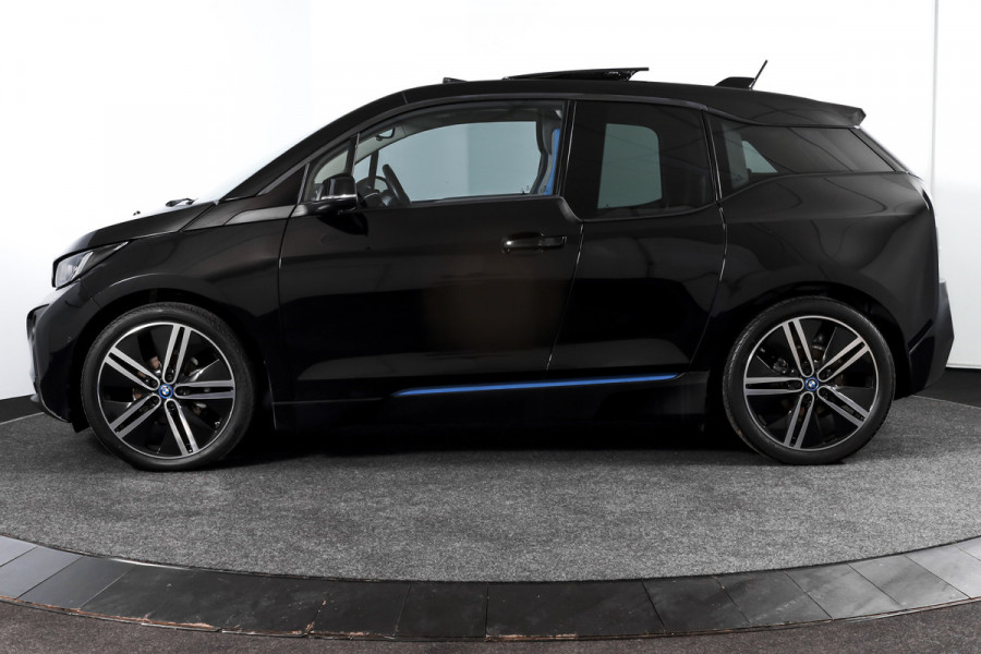 BMW i3 Basis 94Ah 33 kWh | S/k-panodak | Harman/Kardon | Dig. Cockpit | Adapt. cruise | Stoelverw. | PDC | Camera | NAV | ECC | LM 20" |