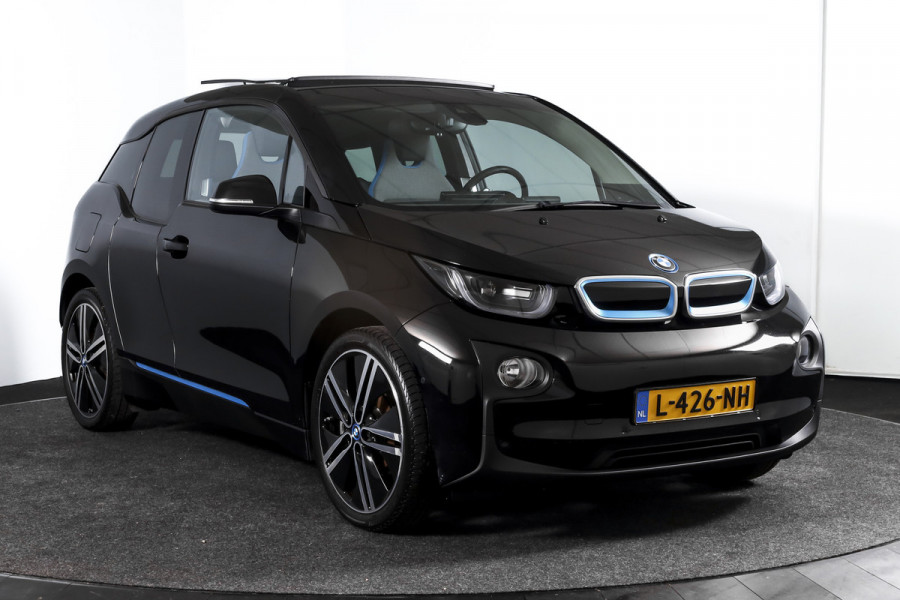 BMW i3 Basis 94Ah 33 kWh | S/k-panodak | Harman/Kardon | Dig. Cockpit | Adapt. cruise | Stoelverw. | PDC | Camera | NAV | ECC | LM 20" |