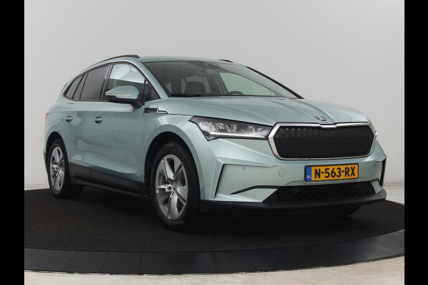 Škoda ENYAQ iV 60 | Warmtepomp | Stoelverwarming | Camera | Keyless | Carplay | Navigatie | Half leder | Full LED | Cruise control | Parkeerhulp | Sfeerverlichting