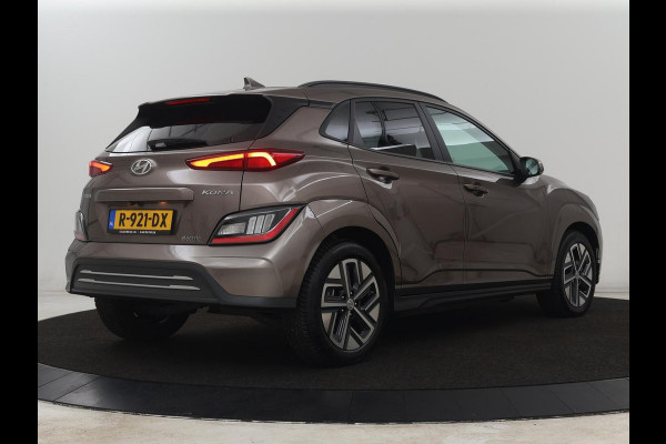 Hyundai Kona EV Fashion 64 kWh | SOH 100% | 3 Fase | Head-Up | Warmtepomp | Adaptive cruise | Camera | Carplay | Keyless | Full LED | Navigatie | Climate control