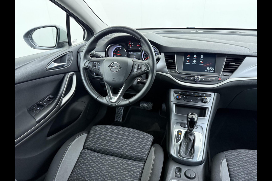 Opel Astra 1.4 Launch Elegance VAN € 18.900 ,- VOOR € 15.877,- UW LENTEVOORDEEL € 3.023,-! | AUTOMAAT | AGR STOELEN | CAMERA | STOEL- & STUURWIELVERWARMING | NAVIGATIE | GOED ONDERHOUDEN | AFNEEMBARE TREKHAAK | INCL. 12 MND BOVAG GARANTIE