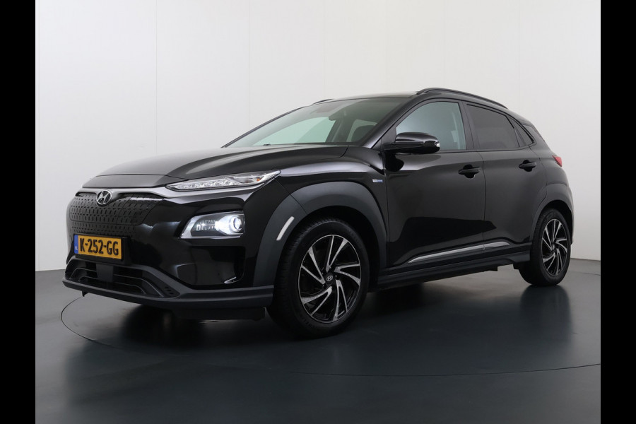 Hyundai Kona EV 64kWh 204pk SOH 100% Premium Schuif-/Kanteldak Leer Warmtepomp Head-Up Display Apple Carplay Android Navi Camera Elektr.Stoel Pdc Subwoofer Bluetooth Dodehoek detector Privacy Glas Rijstrooksensor 1e Eigenaar Origineel Nederlandse Auto Volledig Dealeronderhouden