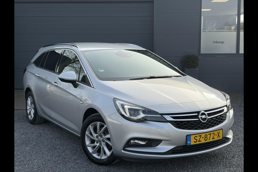 Opel Astra Sports Tourer 1.4 Innovation Dealer Onderhouden,Navi,Camera,Trekhaak,150pk,Keyless,Rijstrooksensor,Halfleder,2e Eigenaar,Lm velgen,BSD,PDC V+A,N.A.P,Apk tot 12-2026