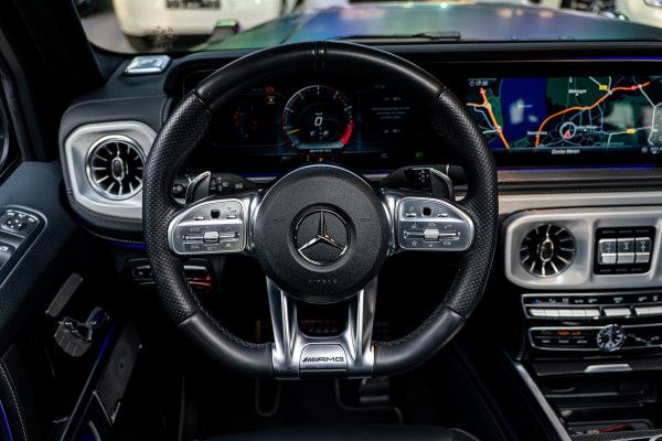 Mercedes-Benz G-Klasse 63 Navi Burmester Leer 360 Camera PTS Open dak Massage Distronic+ Memory seats Stoelventilatie Stoelverwarming Climate voor & achter Trekhaak