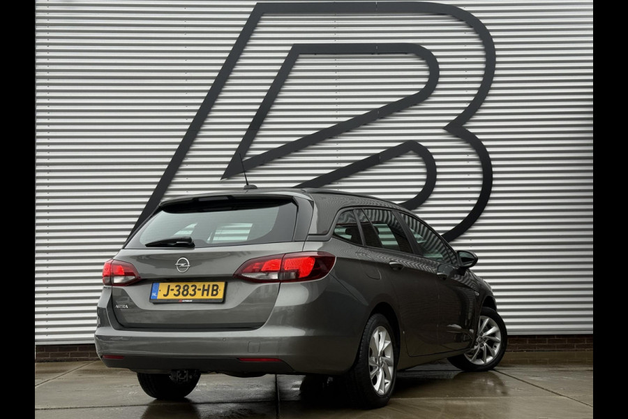 Opel Astra Sports Tourer 1.2 Business Edition 2e Eigenaar,Apple Carplay,Airco,Camera,Cruise,PDC,Trekhaak,N.A.P,APK tot 07-2026