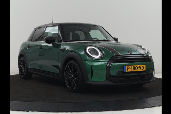 MINI Cooper 1.5 Business Edition | Harman/Kardon | Carplay | Verwarmde voorruit | Navigatie | Full LED | Half leder | Parkeerhulp | Climate control | Cruise control | Bluetooth | British Racing Green