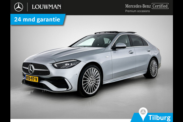 Mercedes-Benz C-Klasse 300 e Business Solution AMG AMG Line | Panorama Schuif-Kanteldak | Distronic | Lederen bekleding | Alarm | Parkeerpakket met 360°-camera | 20 Inch AMG Velgen. Inclusief 24 maanden Mercedes-Benz Certified garantie voor Europa.