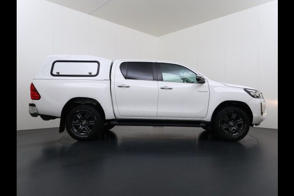 Toyota Hilux 2.4 D-4D 4WD AUT-6 Double Cab Professional Lier Canopy Hardtop (Huif) Trekhaak Navi* via Apple Carplay Android Auto Ecc Camera A Lane Assist Inbouw Kasten Bluetooth AWD EURO6 400Nm *3.500kg Trekvermogen* 1e Eigenaar Dealeronderhouden Origineel Nederlandse Auto