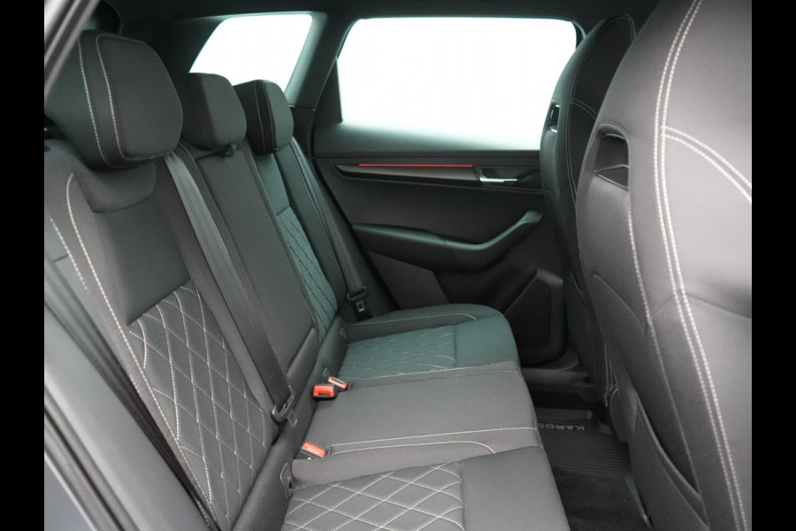 Škoda Karoq 1.5 TSI ACT Sportline Business DSG 150pk | Adaptive Cruise | Camera | Matrix LED | RS Sportstoelen Verwarmd | 18"L.M | Adaptive Onderstel | Keyless | Sfeerverlichting | Apple Carplay | Virtual | Navigatie | DAB |