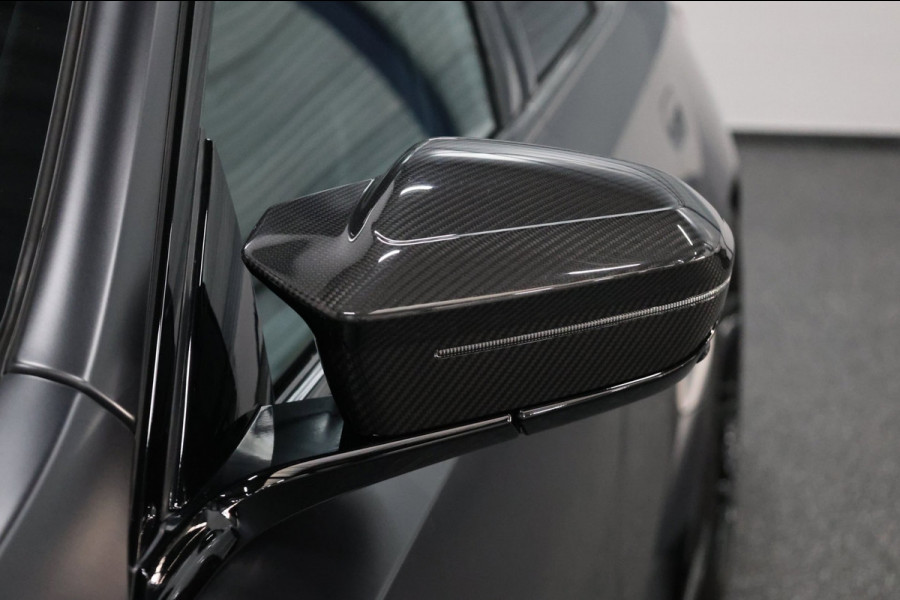 BMW 5 Serie Touring M5 950+PK BTW/AKRAPOVIC OPF DELETED/CARBON M-PERFORMANCE/EVENTURI/22” VOSSEN/B&W/PANO/HUD/12 MND GARANTIE!