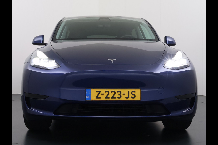 Tesla Model Y 300pk Trekhaak SOH 92% Warmtepomp LFP-Accu Leer Lmv Camera's Panoramadak Adap.Cruise Navi Ecc RWD Autopilot Stoel+Stuur+Achterbank Verwarming Elek.Achterklep Dodehoek detector Draadloze telefoonlader 1e Eigenaar 1.600KG Trekgewicht Fabrieksgarantie op Motor en Accu tot 22-04-2032/160.000km
