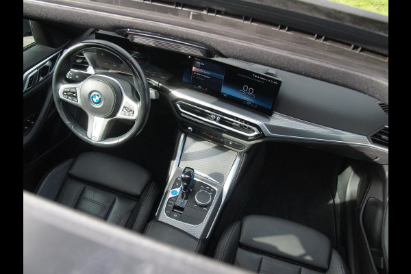 BMW i4 eDrive40 84 kWh | M-Pakket | Schuifdak | Camera | Dravitgrau metallic | NL-Auto |