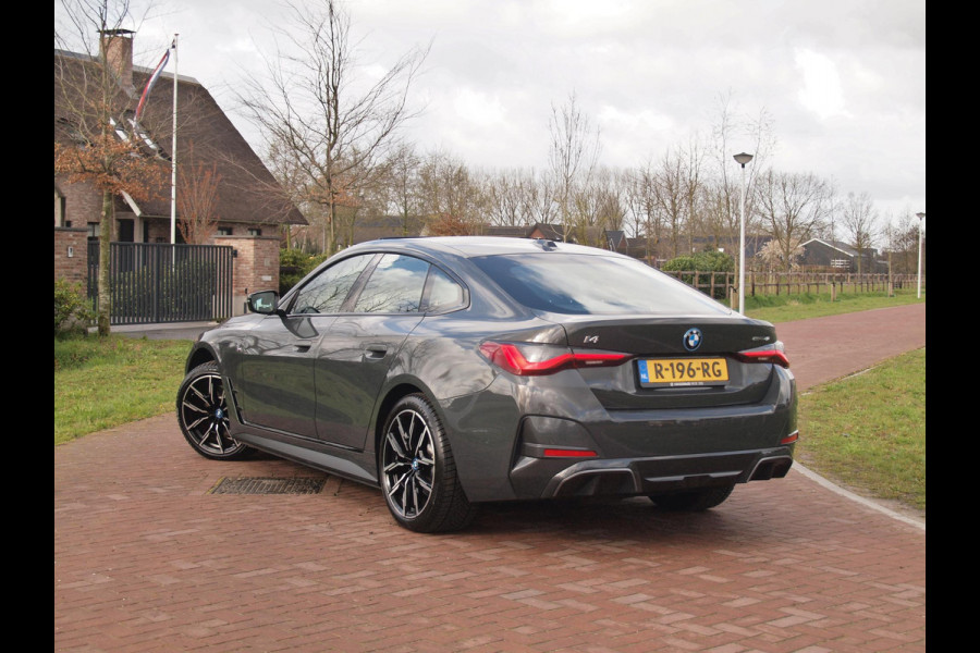 BMW i4 eDrive40 84 kWh | M-Pakket | Schuifdak | Camera | Dravitgrau metallic | NL-Auto |