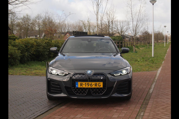 BMW i4 eDrive40 84 kWh | M-Pakket | Schuifdak | Camera | Dravitgrau metallic | NL-Auto |