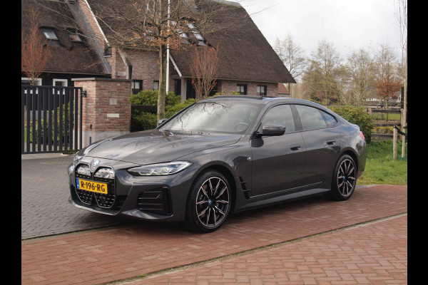 BMW i4 eDrive40 84 kWh | M-Pakket | Schuifdak | Camera | Dravitgrau metallic | NL-Auto |