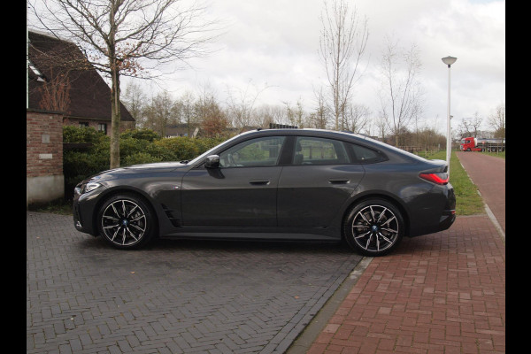 BMW i4 eDrive40 84 kWh | M-Pakket | Schuifdak | Camera | Dravitgrau metallic | NL-Auto |