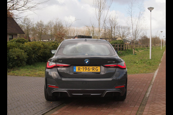 BMW i4 eDrive40 84 kWh | M-Pakket | Schuifdak | Camera | Dravitgrau metallic | NL-Auto |