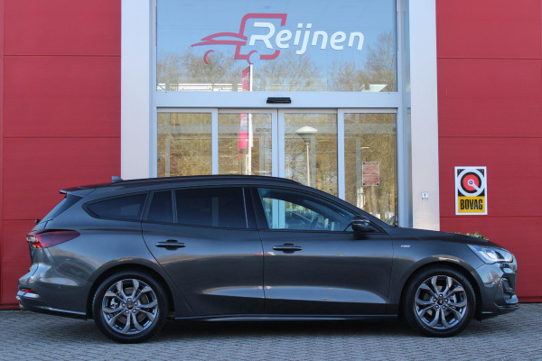 Ford FOCUS Wagon 1.0 155PK AUTOMAAT Hybrid ST LINE | ALL SEASON BANDEN | NAVIGATIE | DRAADLOZE APPLE CARPLAY/ANDROID AUTO | ADAPTIVE CRUISE CONTROL | LANE ASSIST | DODEHOEK DETECTIE | PARKEERSENSOREN VOOR + ACHTER | ACHTERUITRIJ CAMERA | LICHTMETALEN VELGEN 17" | DAB+ RADIO |