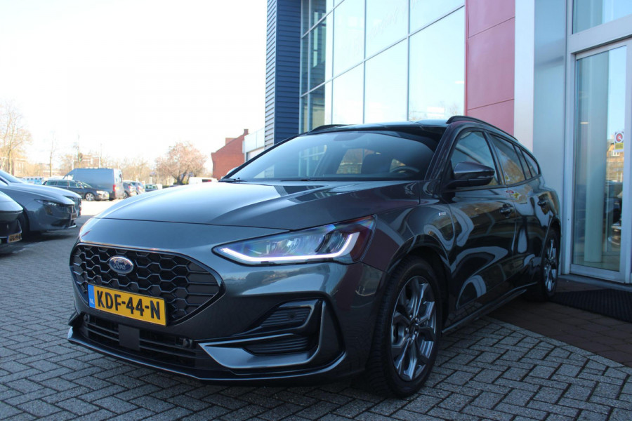 Ford FOCUS Wagon 1.0 155PK AUTOMAAT Hybrid ST LINE | ALL SEASON BANDEN | NAVIGATIE | DRAADLOZE APPLE CARPLAY/ANDROID AUTO | ADAPTIVE CRUISE CONTROL | LANE ASSIST | DODEHOEK DETECTIE | PARKEERSENSOREN VOOR + ACHTER | ACHTERUITRIJ CAMERA | LICHTMETALEN VELGEN 17" | DAB+ RADIO |