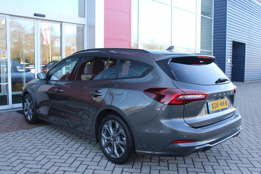 Ford FOCUS Wagon 1.0 155PK AUTOMAAT Hybrid ST LINE | ALL SEASON BANDEN | NAVIGATIE | DRAADLOZE APPLE CARPLAY/ANDROID AUTO | ADAPTIVE CRUISE CONTROL | LANE ASSIST | DODEHOEK DETECTIE | PARKEERSENSOREN VOOR + ACHTER | ACHTERUITRIJ CAMERA | LICHTMETALEN VELGEN 17" | DAB+ RADIO |