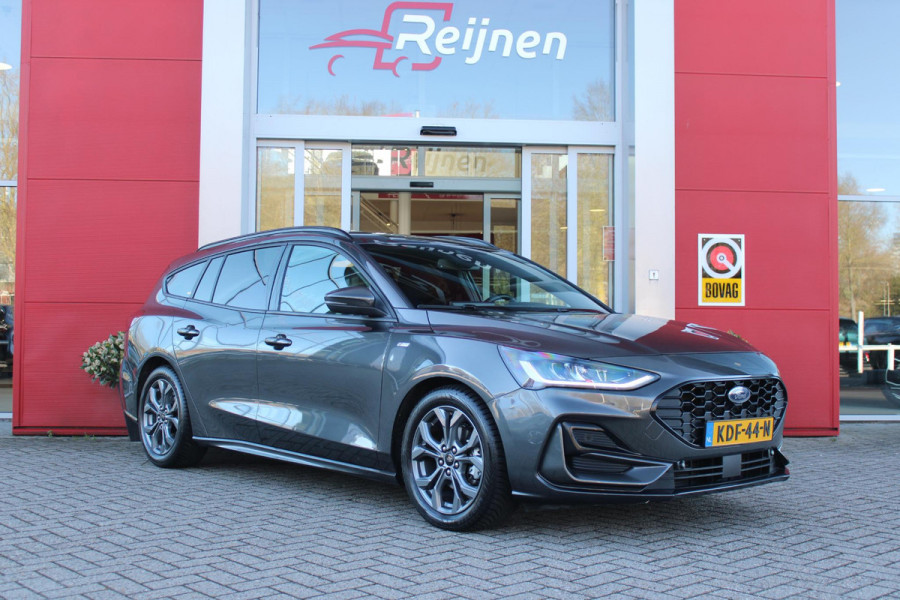 Ford FOCUS Wagon 1.0 155PK AUTOMAAT Hybrid ST LINE | ALL SEASON BANDEN | NAVIGATIE | DRAADLOZE APPLE CARPLAY/ANDROID AUTO | ADAPTIVE CRUISE CONTROL | LANE ASSIST | DODEHOEK DETECTIE | PARKEERSENSOREN VOOR + ACHTER | ACHTERUITRIJ CAMERA | LICHTMETALEN VELGEN 17" | DAB+ RADIO |
