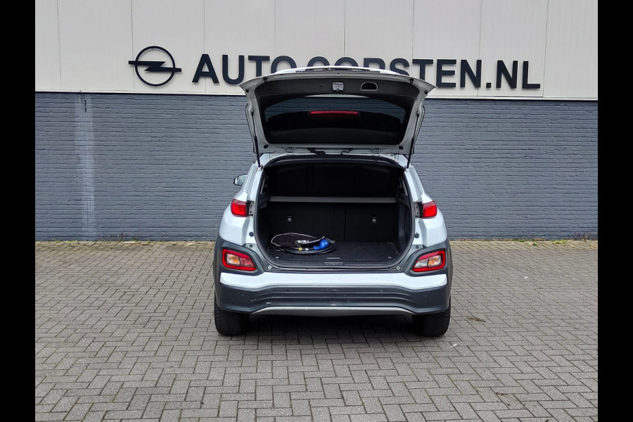 Hyundai Kona EV 64kWh 204pk SOH 100% Leer Premium Schuif-/Kanteldak Warmtepomp Head-Up Display Apple Carplay Android Navi Camera Elektr.Stoel Pdc Subwoofer Bluetooth Dodehoek detector Privacy Glas Rijstrooksensor 1e Eigenaar Origineel Nederlandse Auto Volledig Dealeronderhouden