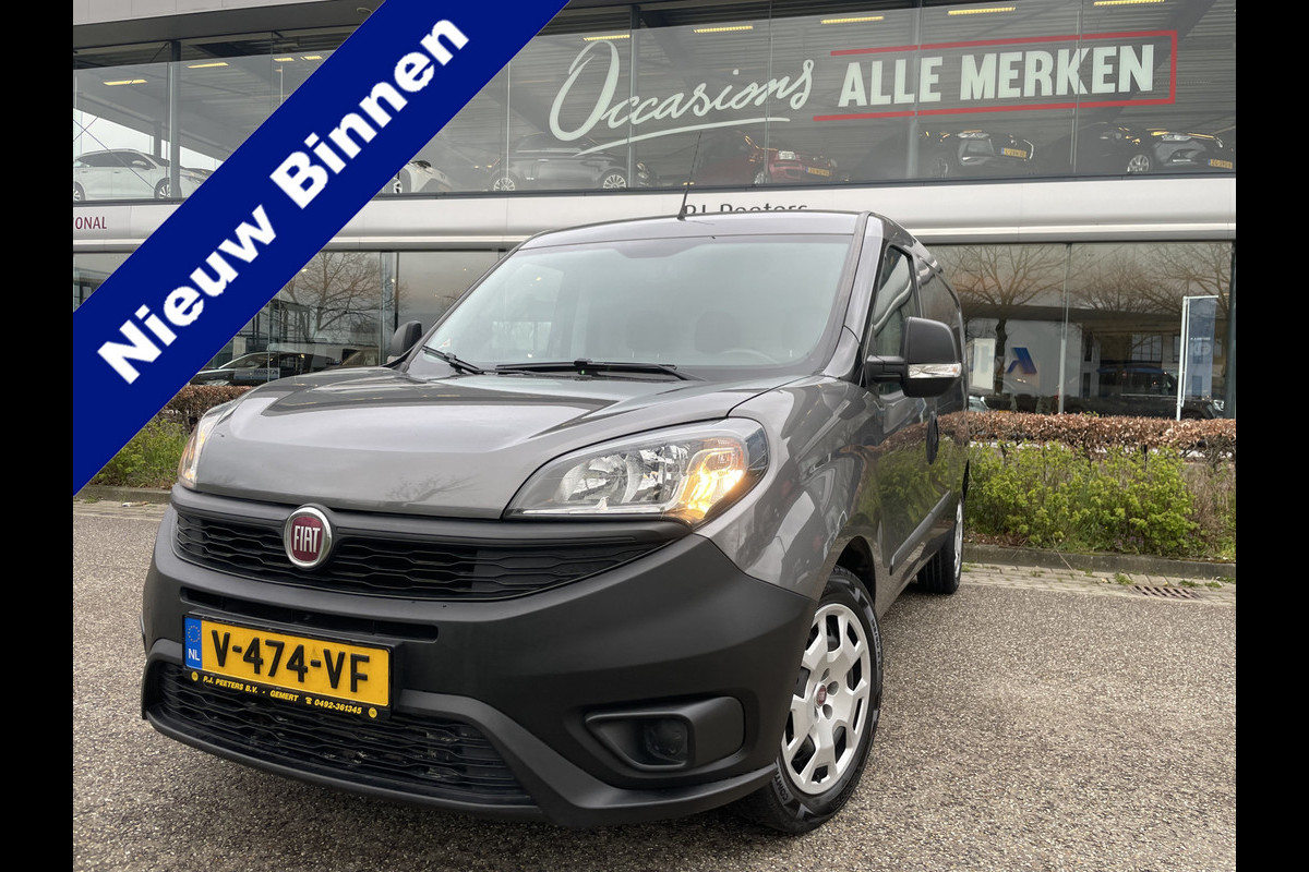 Fiat Doblò Cargo 1.6 MJ L2H1 Maxi Airco - Achteruitrijcamera - Navigatie - Cruise control - 3 zitplaatsen - Zijschuifdeur rechts - Tussenschot volledig - Elektrische ramen voor - Bluetooth - Stuur multifunctioneel - Radio
