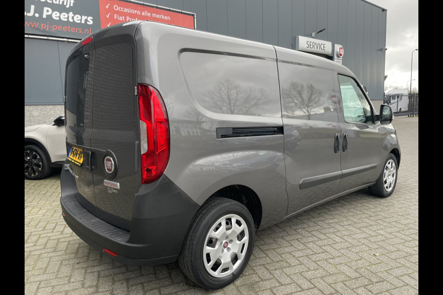 Fiat Doblò Cargo 1.6 MJ L2H1 Maxi Airco - Achteruitrijcamera - Navigatie - Cruise control - 3 zitplaatsen - Zijschuifdeur rechts - Tussenschot volledig - Elektrische ramen voor - Bluetooth - Stuur multifunctioneel - Radio