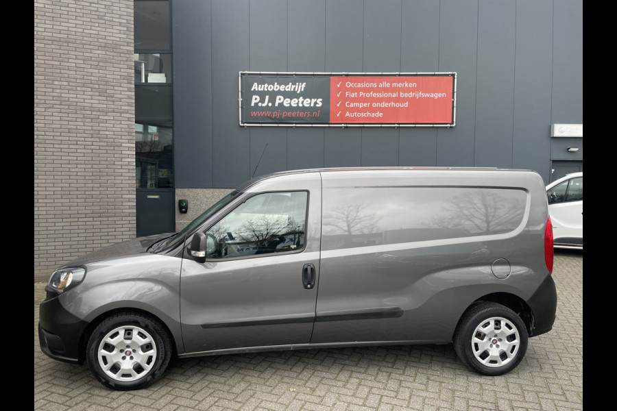 Fiat Doblò Cargo 1.6 MJ L2H1 Maxi Airco - Achteruitrijcamera - Navigatie - Cruise control - 3 zitplaatsen - Zijschuifdeur rechts - Tussenschot volledig - Elektrische ramen voor - Bluetooth - Stuur multifunctioneel - Radio