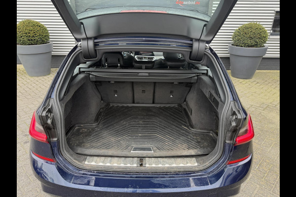 BMW 3 Serie Touring 320i High Executive M-Sport | Panoramadak | Camera | Head-Up Display | DAB |