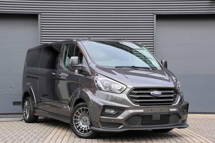 Ford Transit Custom 320 2.0 TDCI L2H1 MS-RT | ACC | BLIS | L+R Schuifdeur | SORTIMO | CarPlay | Navigatie | Camera | Stoelverwarming | 3-Zitter | PPF Folie | Lederen bekleding | Spoiler-pakket | Nieuwe APK