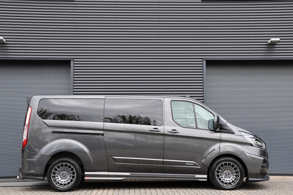 Ford Transit Custom 320 2.0 TDCI L2H1 MS-RT | ACC | BLIS | L+R Schuifdeur | SORTIMO | CarPlay | Navigatie | Camera | Stoelverwarming | 3-Zitter | PPF Folie | Lederen bekleding | Spoiler-pakket | Nieuwe APK